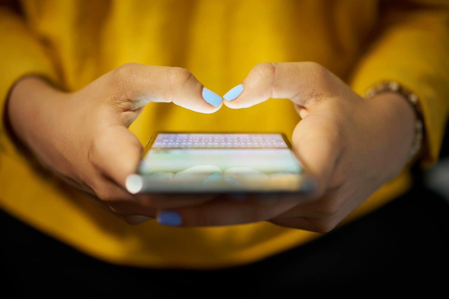 I Stock 598912704 e1668482587646 PiA Woman Typing Phone Message On Social Network At Night